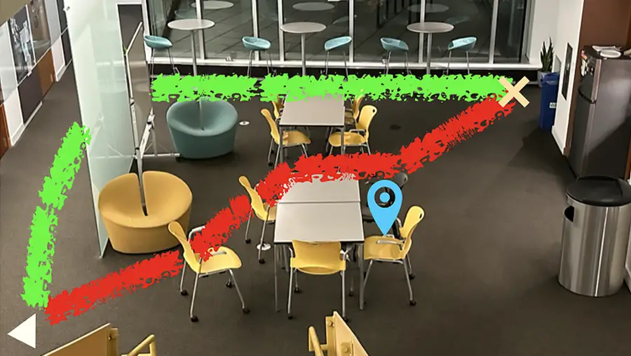 Picture of a room with two paths mapped out, a noisy one in red, and a longer and quieter one in green.