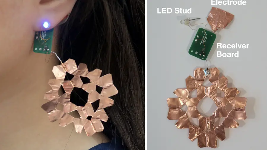 Light-up earring made of an LED stud, small receiver board, and two flat copper electrodes